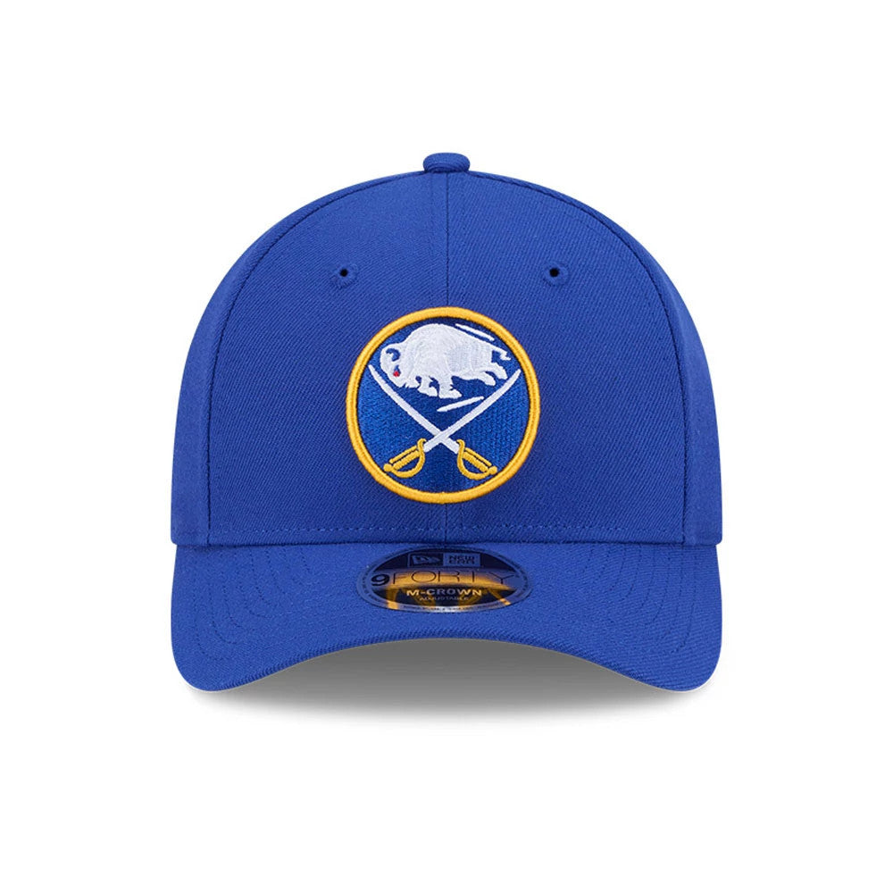 Buffalo Sabres NHL Team Blue New Era 9FORTY M-Crown Adjustable Cap, front view featuring the raised white and yellow embroidered team logo on the structured blue crown, with a 9FORTY size sticker on the curved visor.