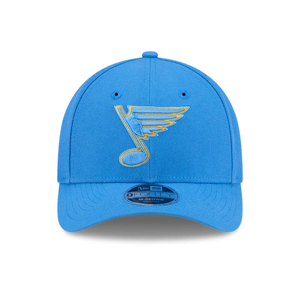 St. Louis Blues NHL Team Blue New Era 9FORTY M-Crown Adjustable Cap, front view showing the raised blue and yellow embroidered logo on the front panel with a curved visor and the 9FORTY size sticker in place.