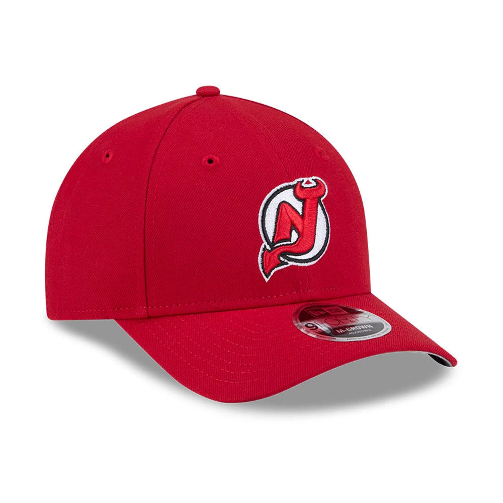 New Jersey Devils NHL Team Red New Era 9FORTY M-Crown Adjustable Cap, three-quarter view showing the raised embroidered Devils logo on the front panel, red curved visor with 9FORTY size sticker, and top button, all in matching red fabric.