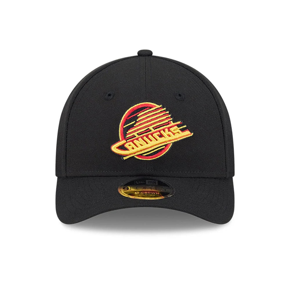 Vancouver Canucks NHL Team Black New Era 9FORTY M-Crown Adjustable Cap, front view showing the raised embroidered red and yellow Canucks logo on the structured black crown, with a 9FORTY size sticker on the curved black visor.