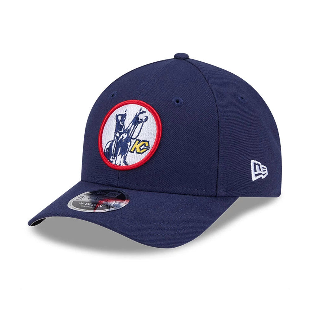 Kansas City Scouts NHL Team Navy New Era 9FORTY M-Crown Adjustable Cap, three-quarter view with a red-bordered round team logo embroidered on the navy front panel, a New Era flag logo on the left side, and a 9FORTY size sticker on the curved visor.