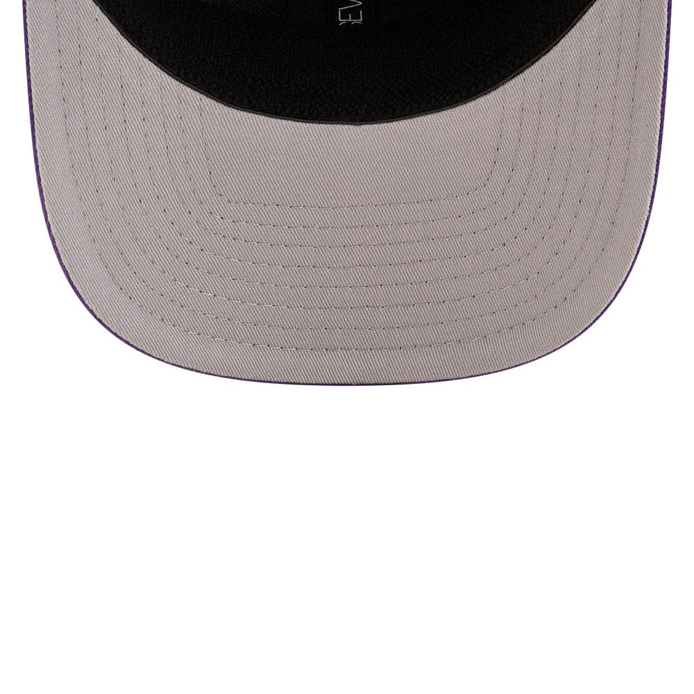 LA Kings NHL Team Purple New Era 9SEVENTY Stretch Snap Adjustable Cap, inside view showing the grey undervisor with purple edge stitching and the black sweatband with New Era branding.