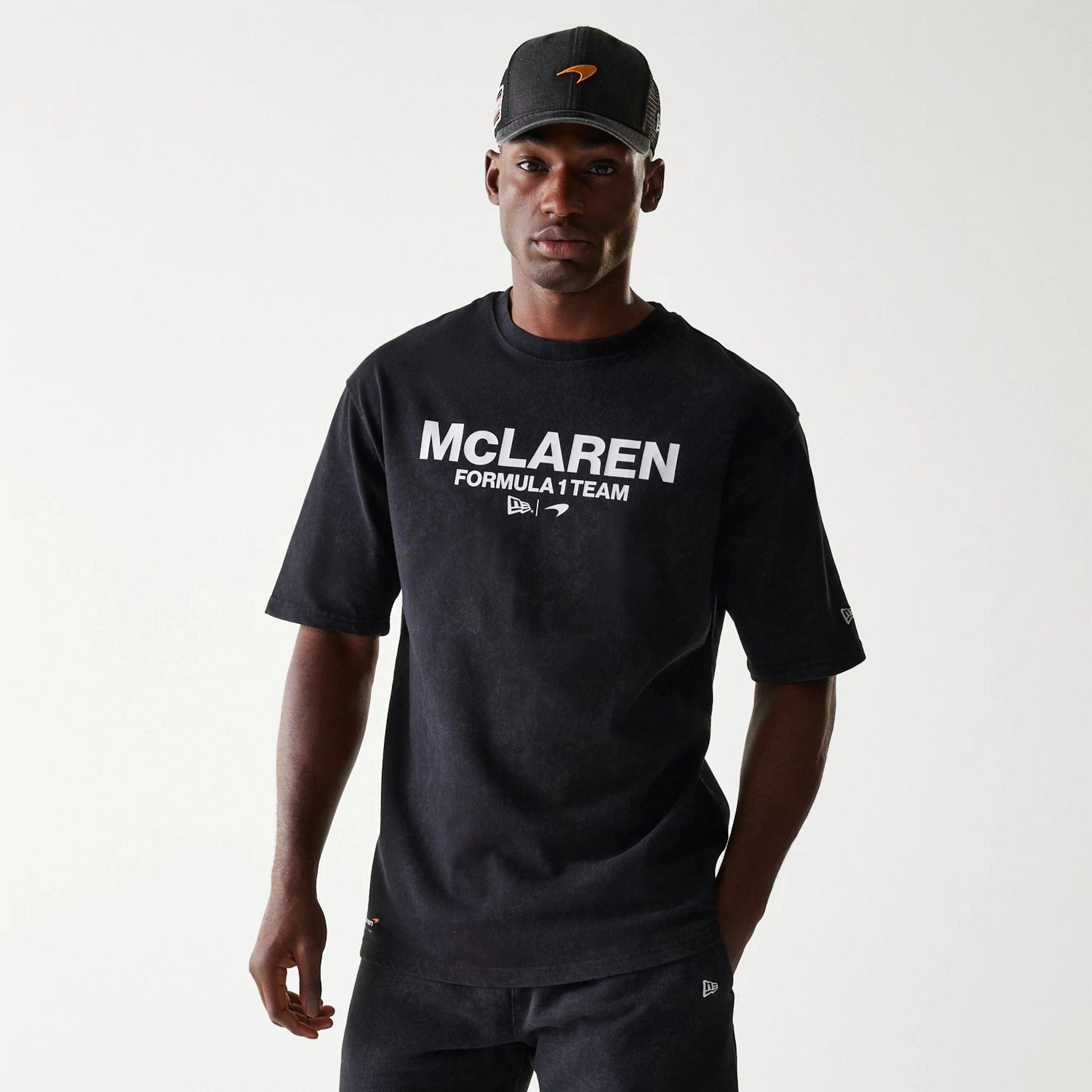 The Male model is wearing McLaren Racing Wordmark Black Oversized T-Shirt 1