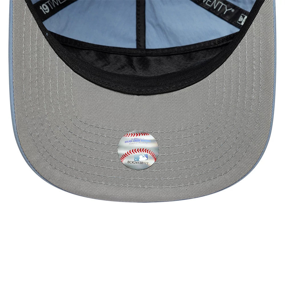 New York Yankees MLB Nylon Open Blue New Era 19TWENTY Adjustable Cap, inside view showing a light blue undervisor with a glossy baseball-themed sticker, black sweatband, and labelled taping along the seams.