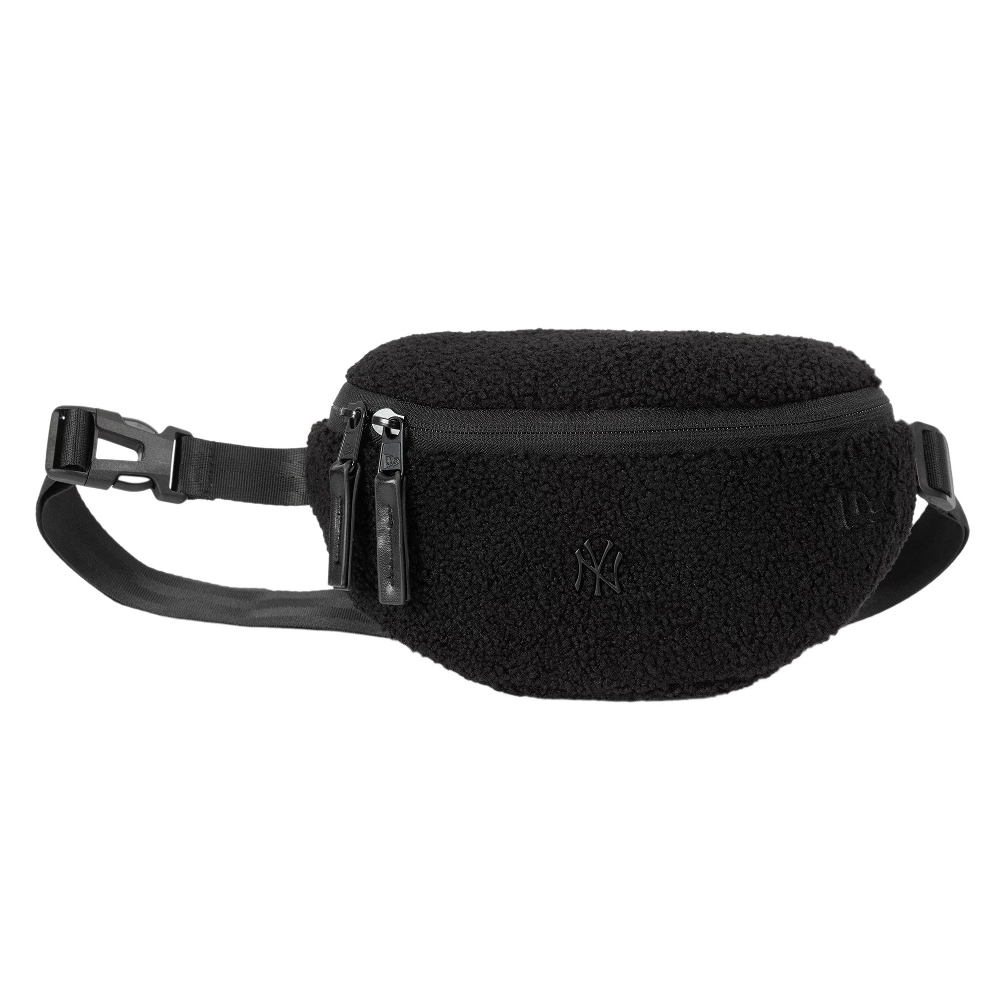 New Era New York Yankees MLB Borg Pin Black Waist Bag, side view displaying the fluffy black texture with a zip closure, a debossed NY logo on the front, and an adjustable strap with a buckle on the side.