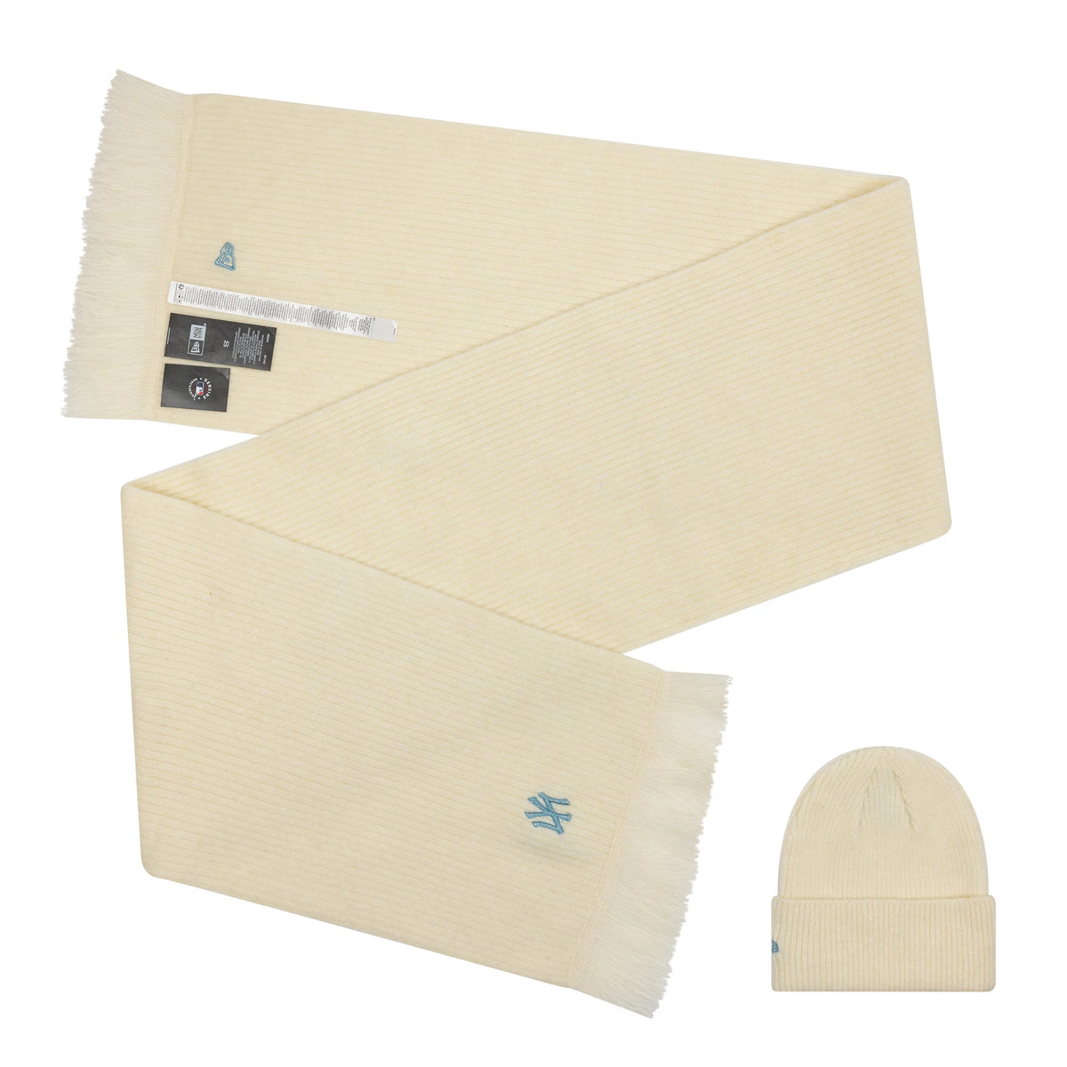 New Era New York Yankees MLB Cream Beanie & Scarf Set, top view showing the cream-coloured scarf with fringed edges and an embroidered Yankees logo, paired with a matching cream beanie featuring the same embroidered logo on the cuff.