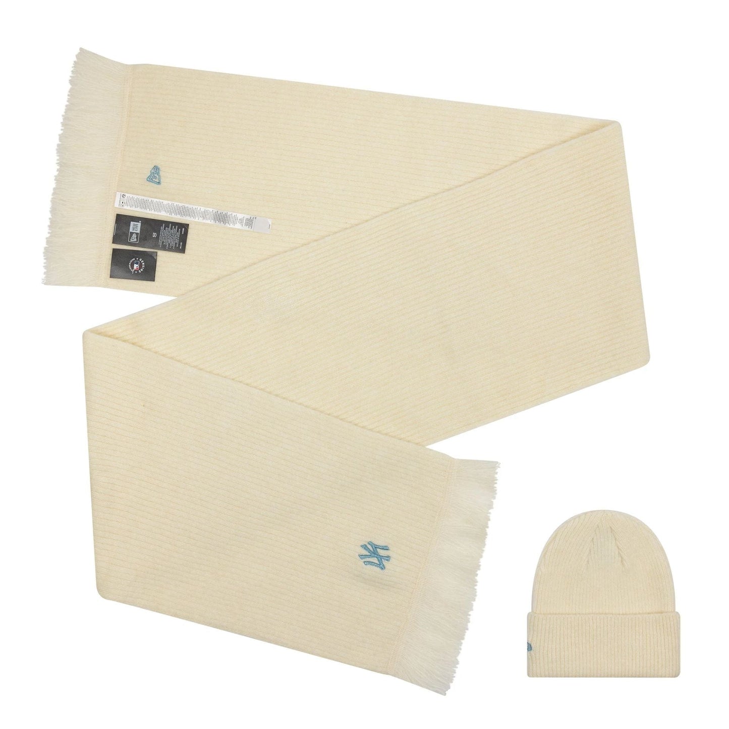 New Era New York Yankees MLB Cream Beanie & Scarf Set, top view showing the cream-coloured scarf with fringed edges and an embroidered Yankees logo, paired with a matching cream beanie featuring the same embroidered logo on the cuff.