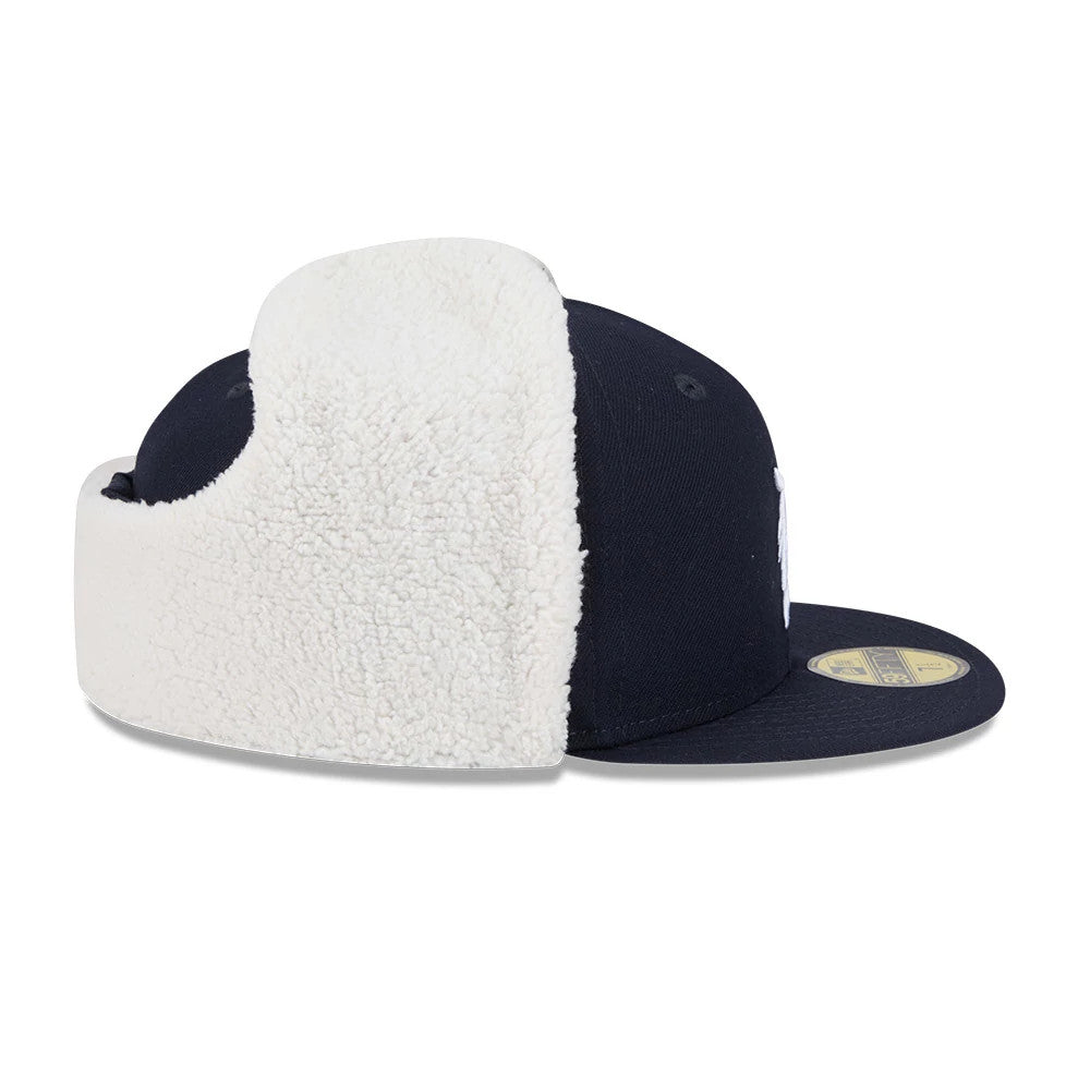 Detroit Tigers MLB Classic Navy Dogear New Era 59FIFTY Fitted Cap, side view showing the fluffy white dogear flaps extended, a structured navy crown, and a flat navy visor with a gold 59FIFTY size sticker on top.