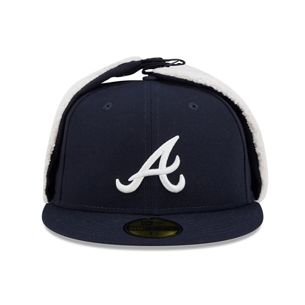 Atlanta Braves MLB Classic Navy Dogear New Era 59FIFTY Fitted Cap, front view showing the white embroidered A logo on navy front panel, with fuzzy white dogear flaps tied on top and a gold 59FIFTY size sticker on the visor.