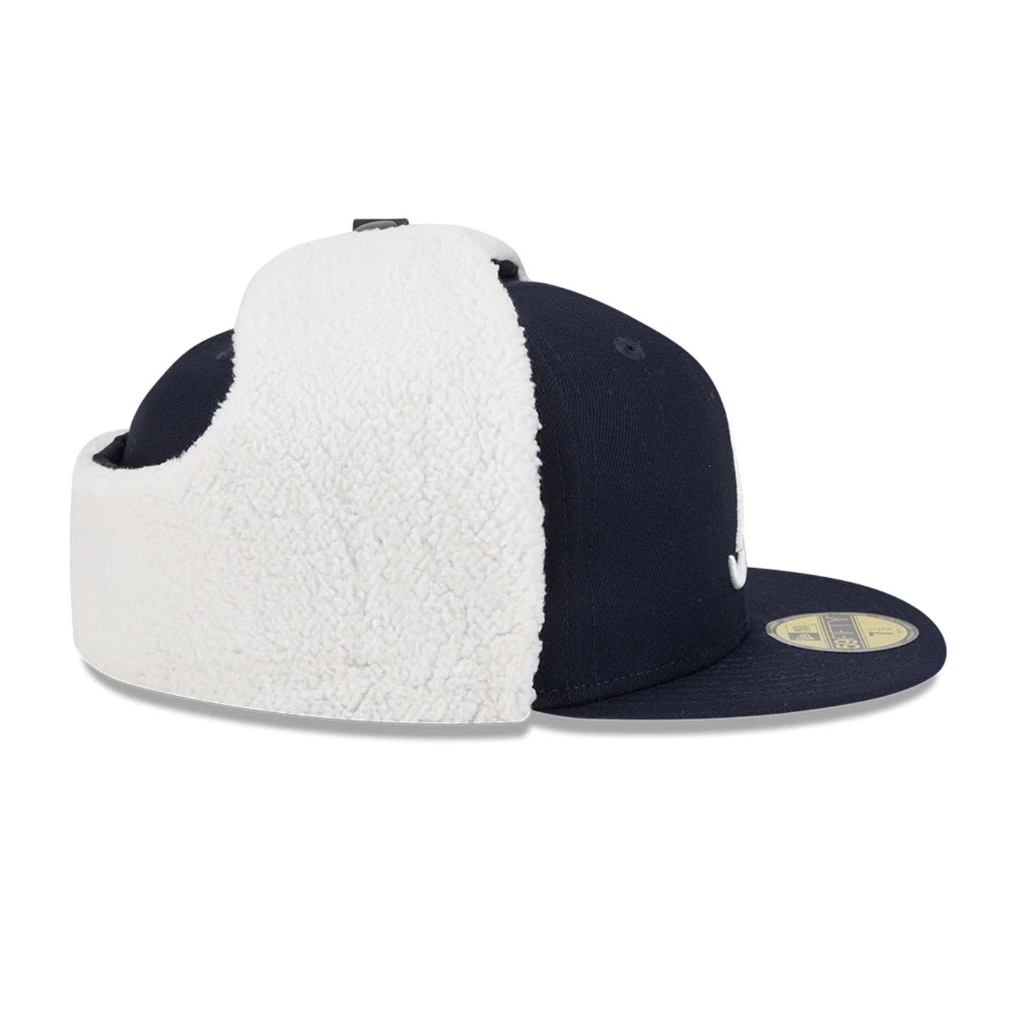 Atlanta Braves MLB Classic Navy Dogear New Era 59FIFTY Fitted Cap, side view showing folded white fluffy dogear panels, the navy structured crown, dark navy flat visor, and a gold 59FIFTY size sticker with eyelets on the crown.