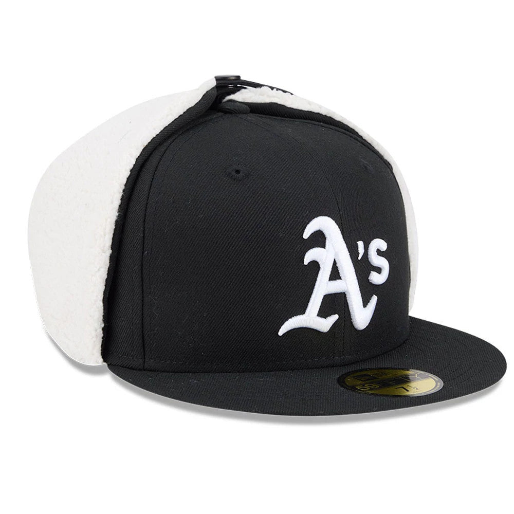 Athletics MLB Classic Black Dogear New Era 59FIFTY Fitted Cap, three-quarter view showing the raised white embroidered A's logo on the front, black flat visor with the gold 59FIFTY size sticker, and white sherpa dogear flaps.