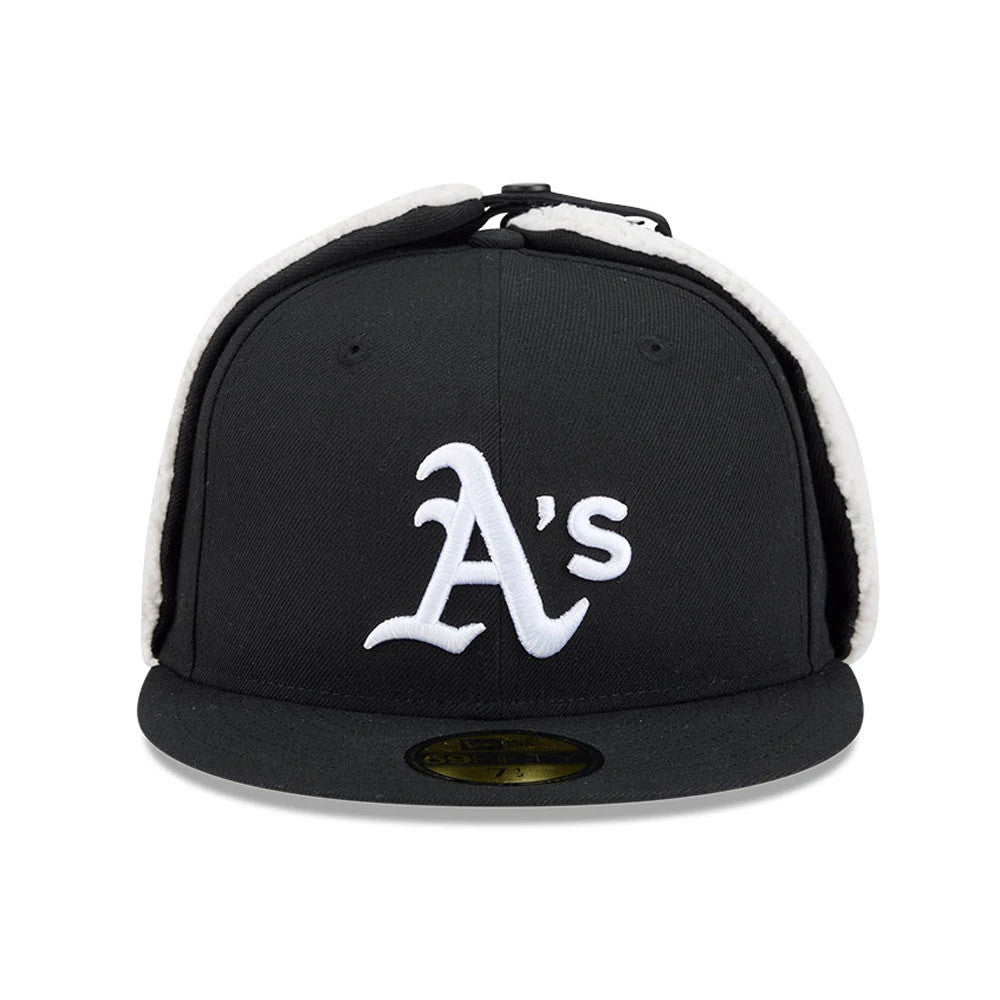 Athletics MLB Classic Black Dogear New Era 59FIFTY Fitted Cap, front view showing white raised embroidered A's logo on the structured black crown, with protective dogear flaps and a gold 59FIFTY size sticker on the flat black visor.