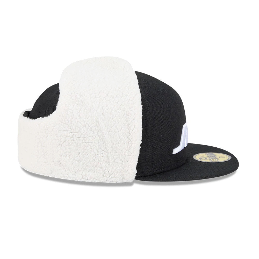 New York Jets NFL Classic Black Dogear New Era 59FIFTY Fitted Cap, side view showing the white logo embroidery on the front panel, with cream-coloured dog ear flaps down over the black structured crown.