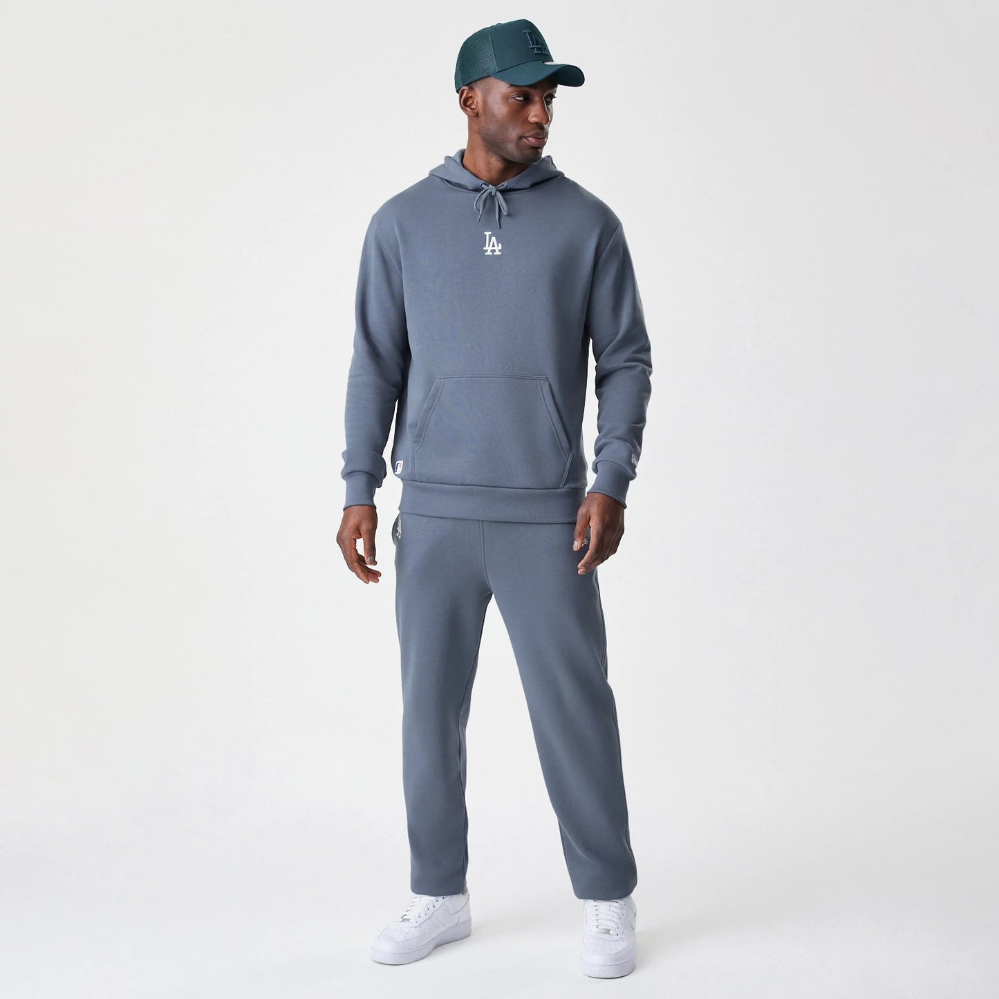 The Male model is wearing LA Dodgers MLB Midi League Essential Dark Grey Oversized Pullover Hoodie 8