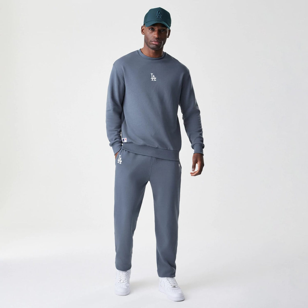The Male model is wearing LA Dodgers MLB Midi League Essential Dark Grey Oversized Crew Neck Sweater 8
