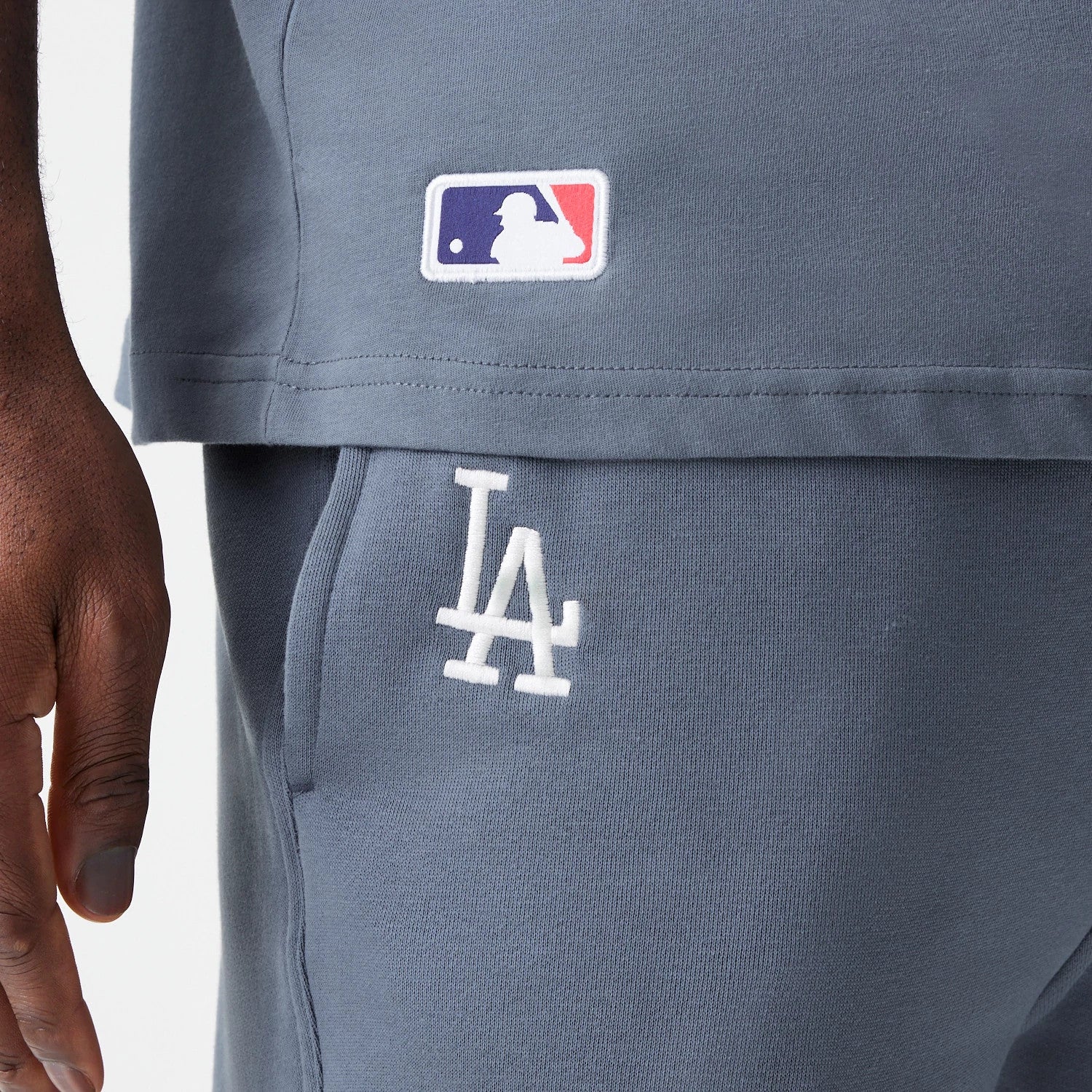 The Male model is wearing LA Dodgers MLB Midi League Essential Dark Grey Joggers 3