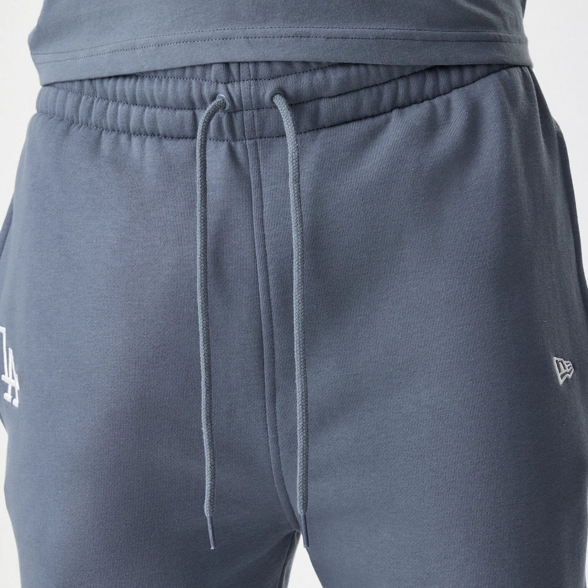 The Male model is wearing LA Dodgers MLB Midi League Essential Dark Grey Joggers 4