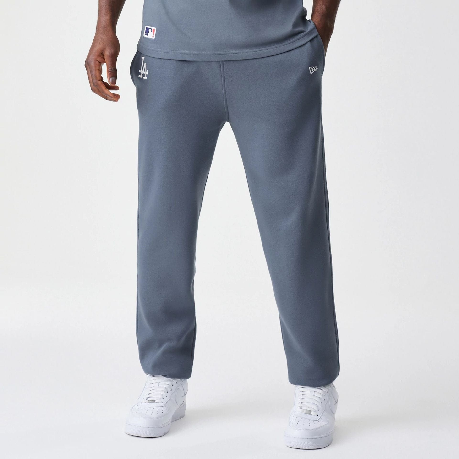 The Male model is wearing LA Dodgers MLB Midi League Essential Dark Grey Joggers 1