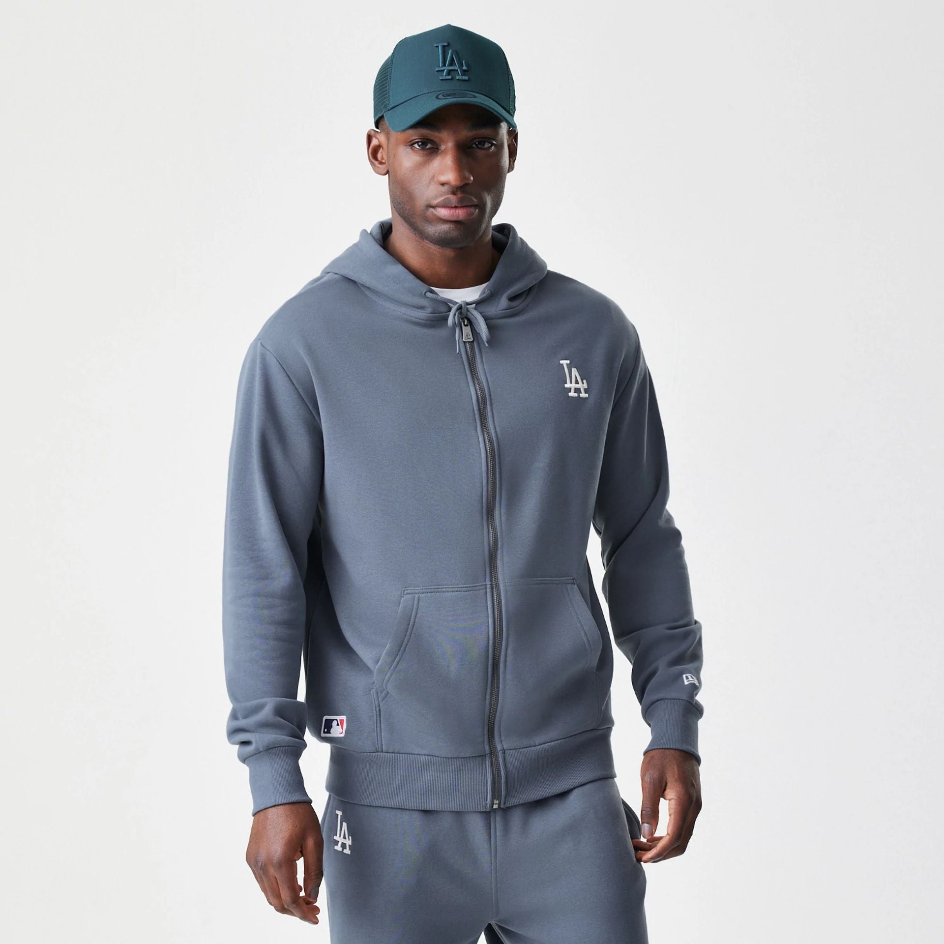 The Male model is wearing LA Dodgers MLB Midi League Essential Dark Grey Full Zip Hoodie 1