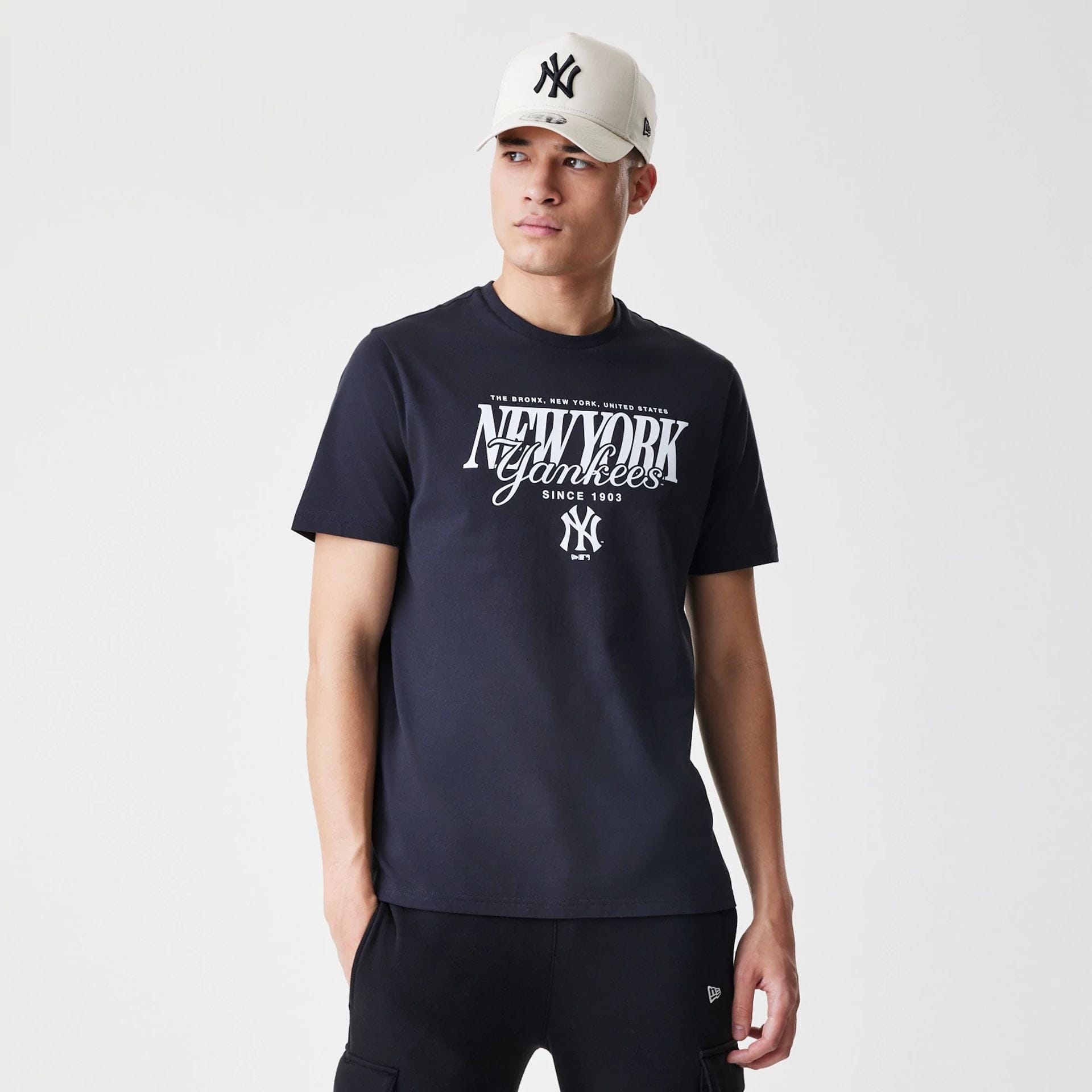 The Male model is wearing New York Yankees MLB Script Graphic Navy T-Shirt 1