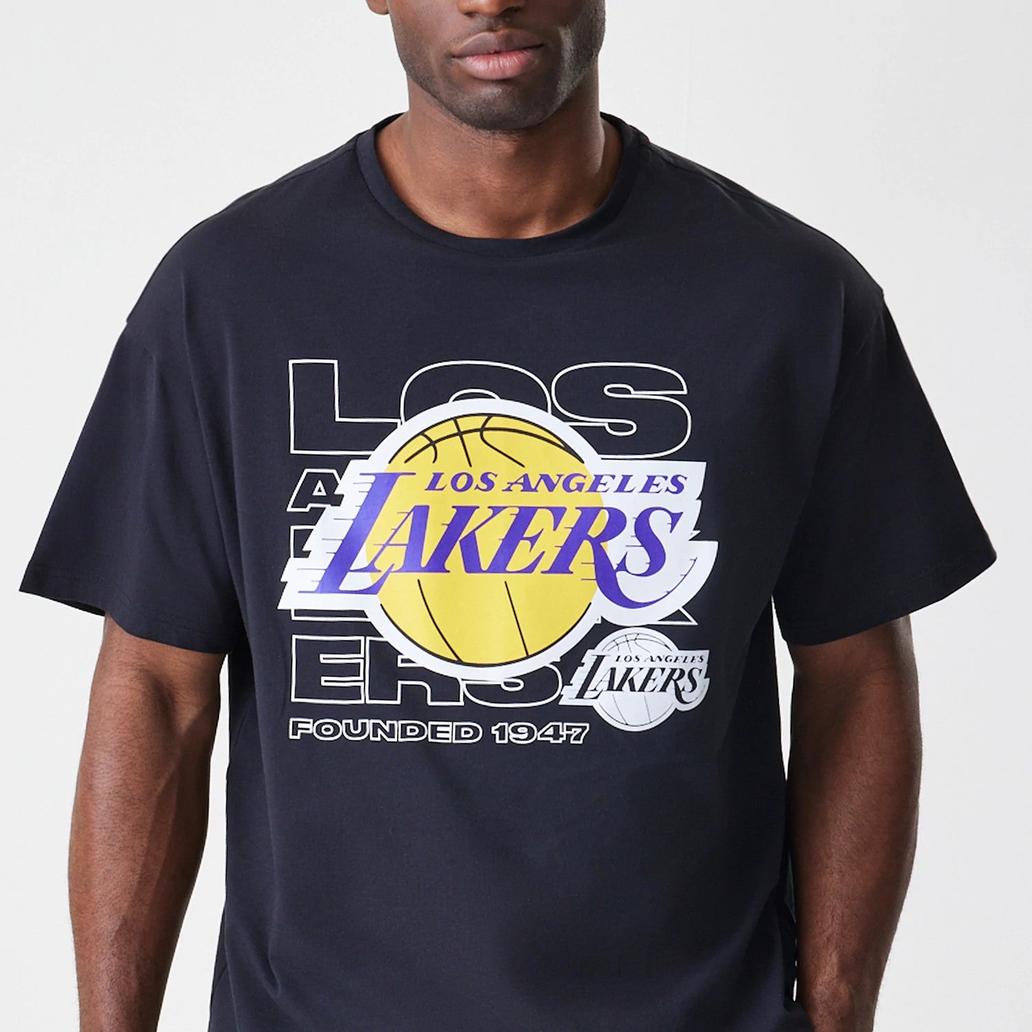 The Male model is wearing LA Lakers NBA Outline Graphic Navy Oversized T-Shirt 3