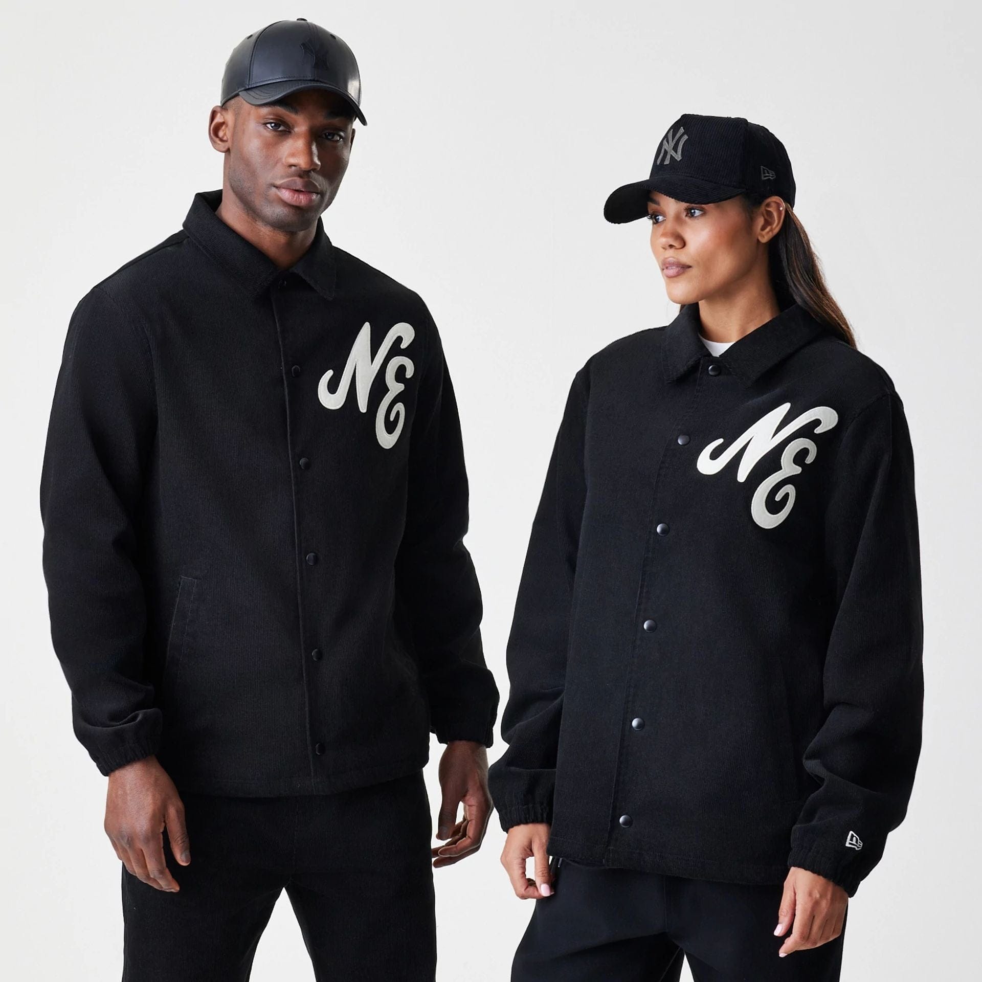 The Male model is wearing New Era Cord Black Coaches Jacket 1