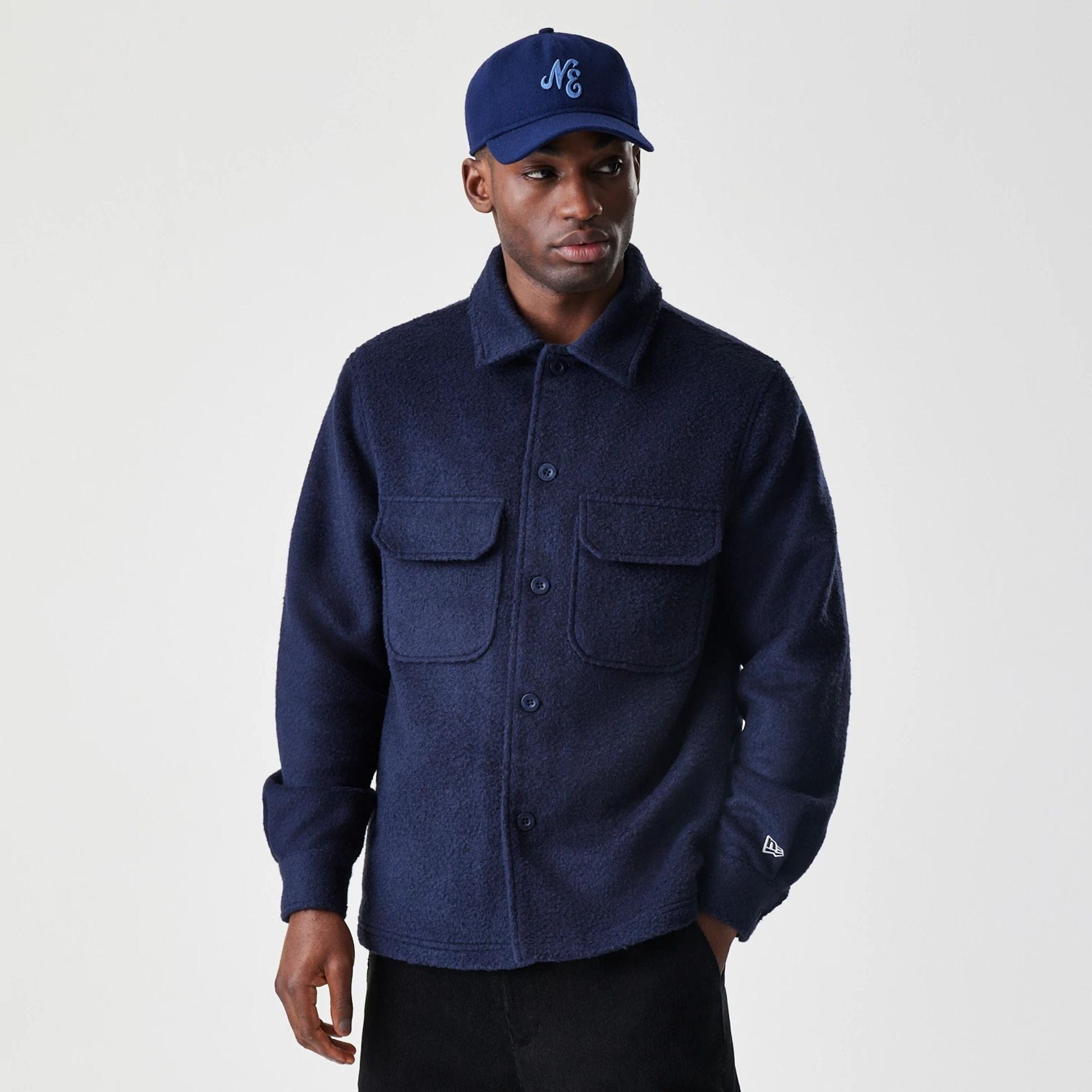 The Male model is wearing New Era Borg Navy Shacket 1