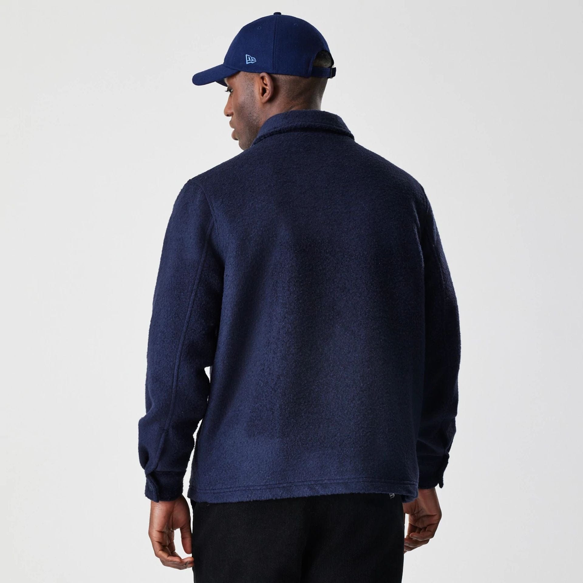 The Male model is wearing New Era Borg Navy Shacket 2