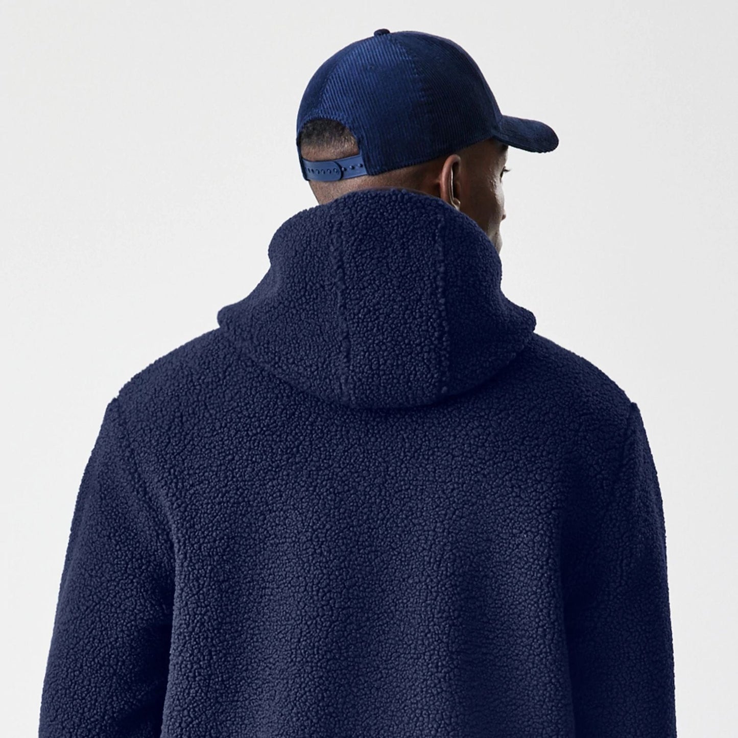 The Male model is wearing New Era Navy Hooded Sherpa Jacket 8