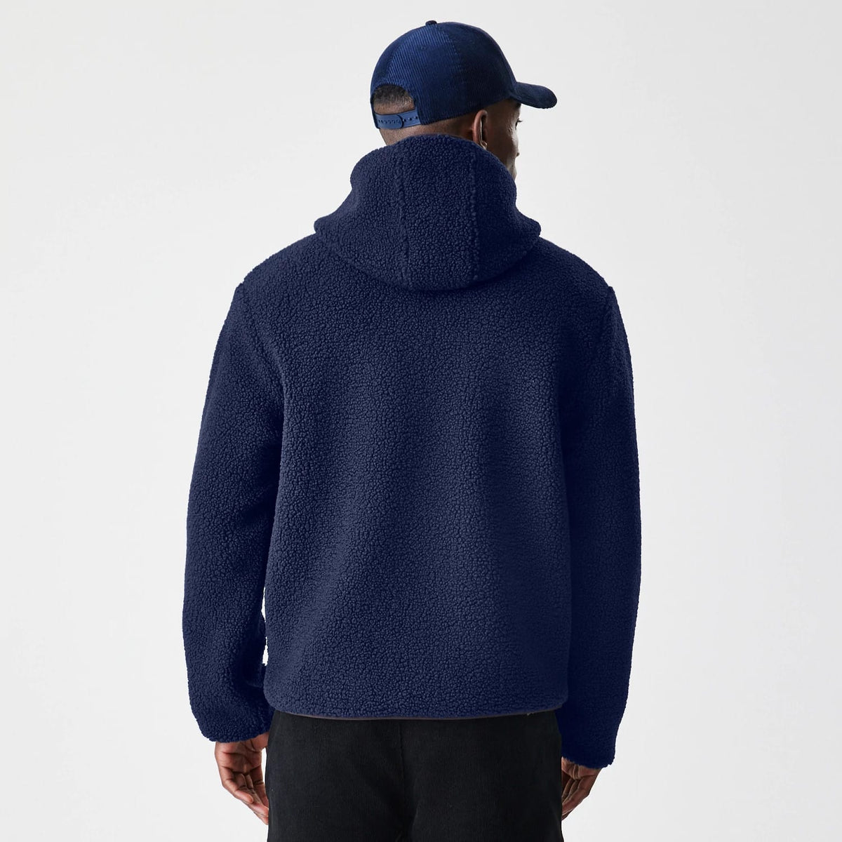 The Male model is wearing New Era Navy Hooded Sherpa Jacket 2