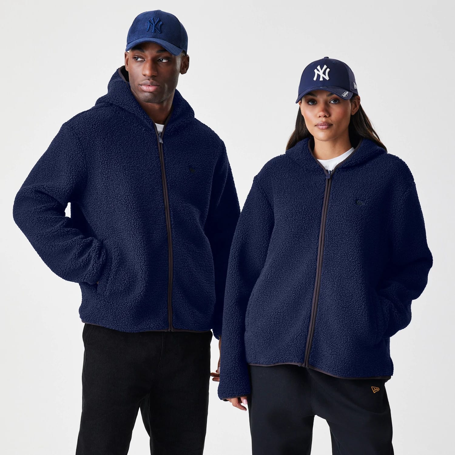 The Male model is wearing New Era Navy Hooded Sherpa Jacket 1
