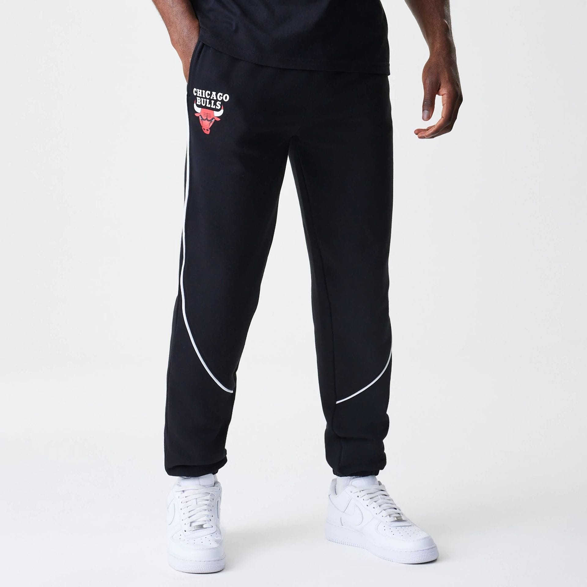 The Male model is wearing Chicago Bulls NBA Piping Navy Joggers 1