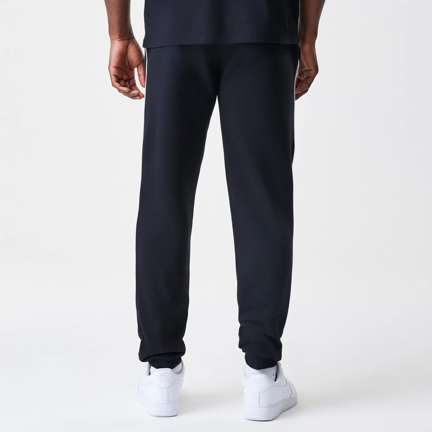 The Male model is wearing Chicago Bulls NBA Piping Navy Joggers 2