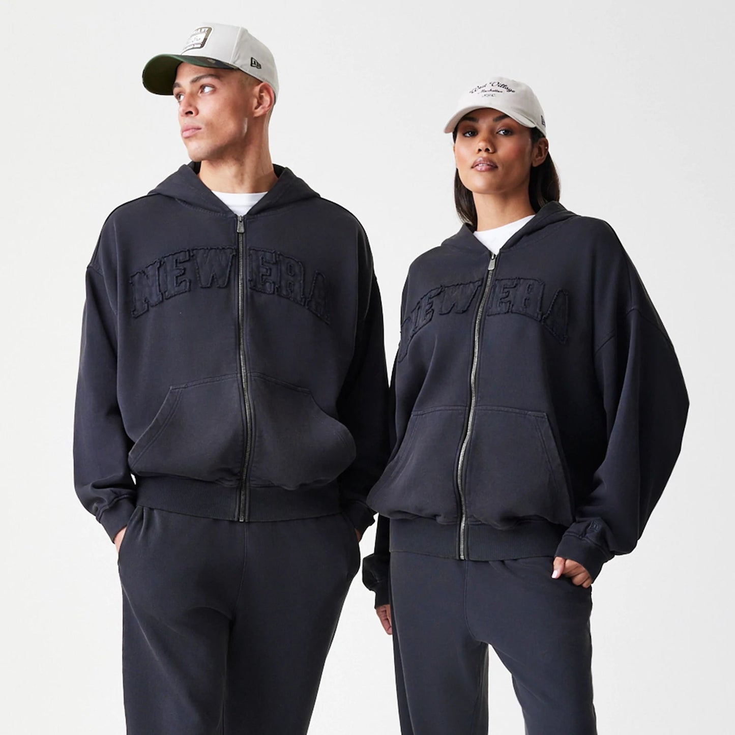 The Male model is wearing New Era Washed Black Oversized Full Zip Hoodie 8