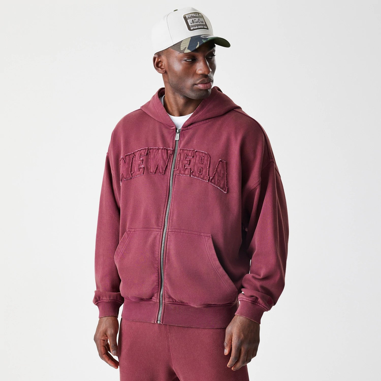 The Male model is wearing New Era Washed Dark Red Oversized Full Zip Hoodie 3