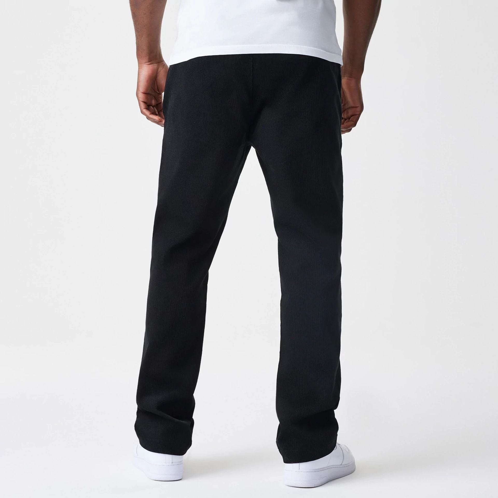 The Male model is wearing New Era Cord Black Straight Leg Chinos 2
