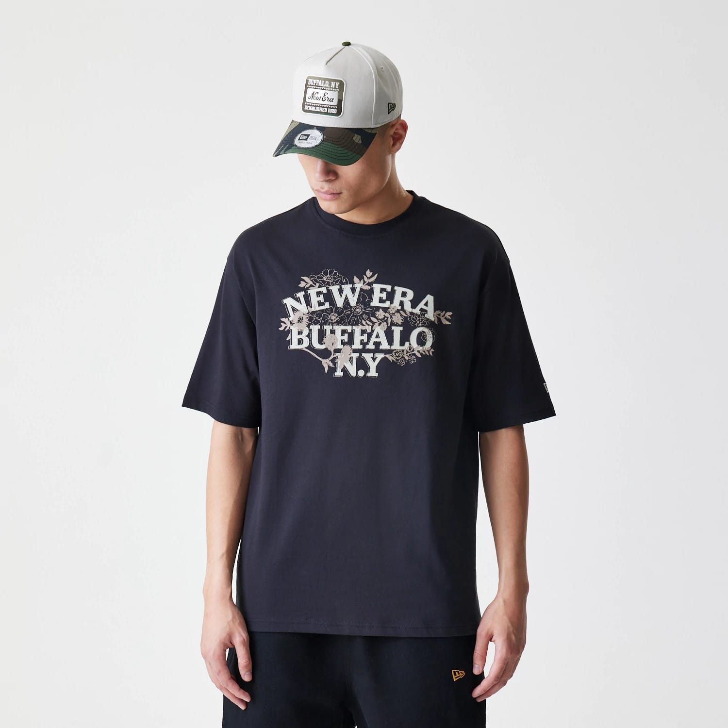 The Male model is wearing New Era Floral Black Oversized T-Shirt 1