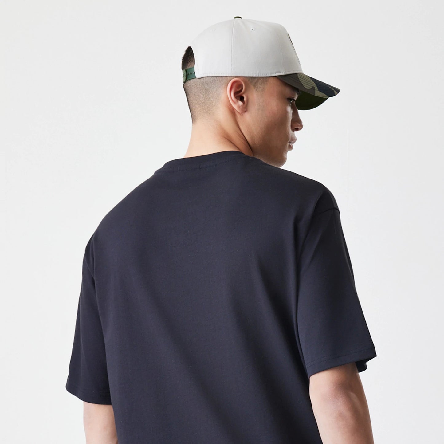 The Male model is wearing New Era Floral Black Oversized T-Shirt 7