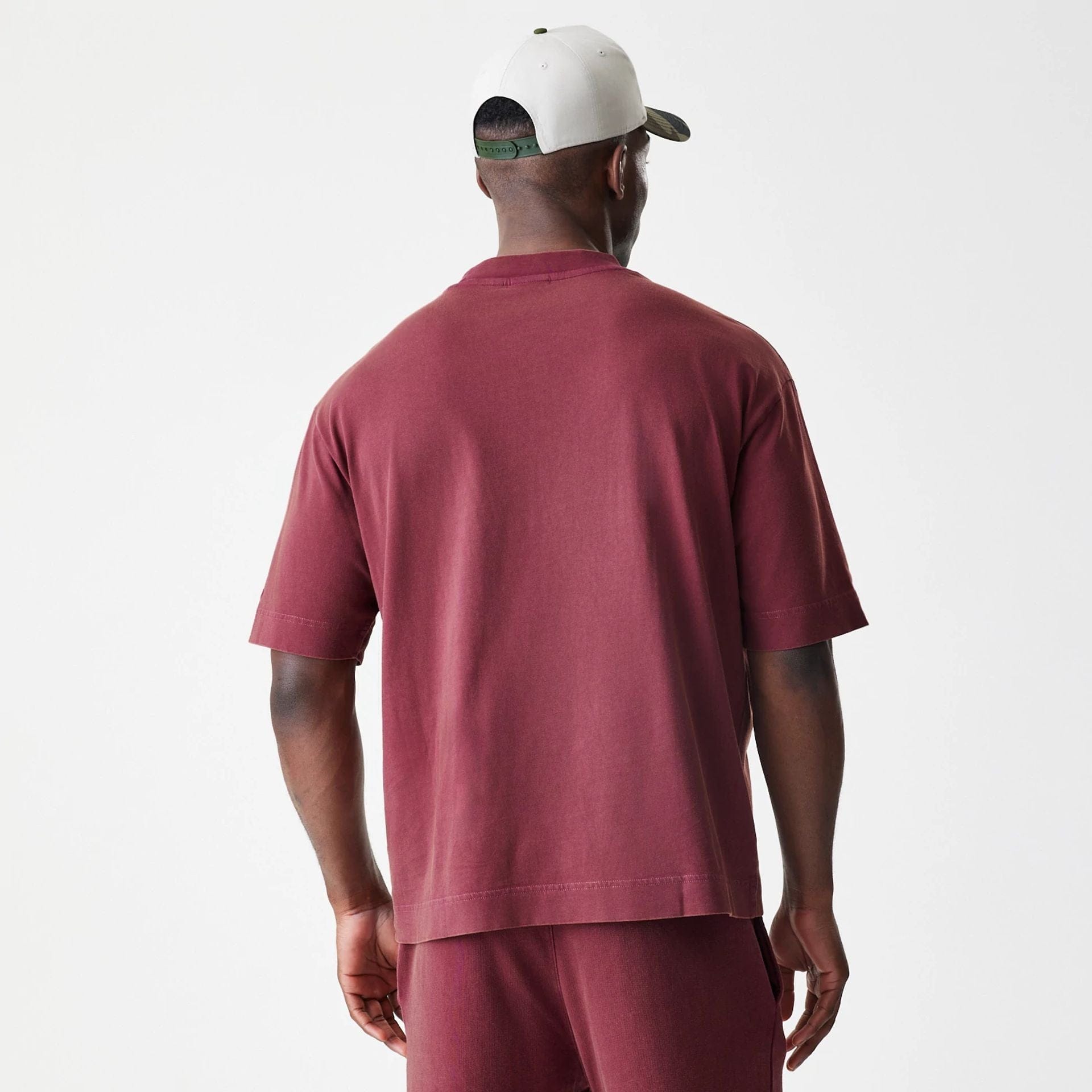 The Male model is wearing New Era Washed Dark Red Oversized T-Shirt 2