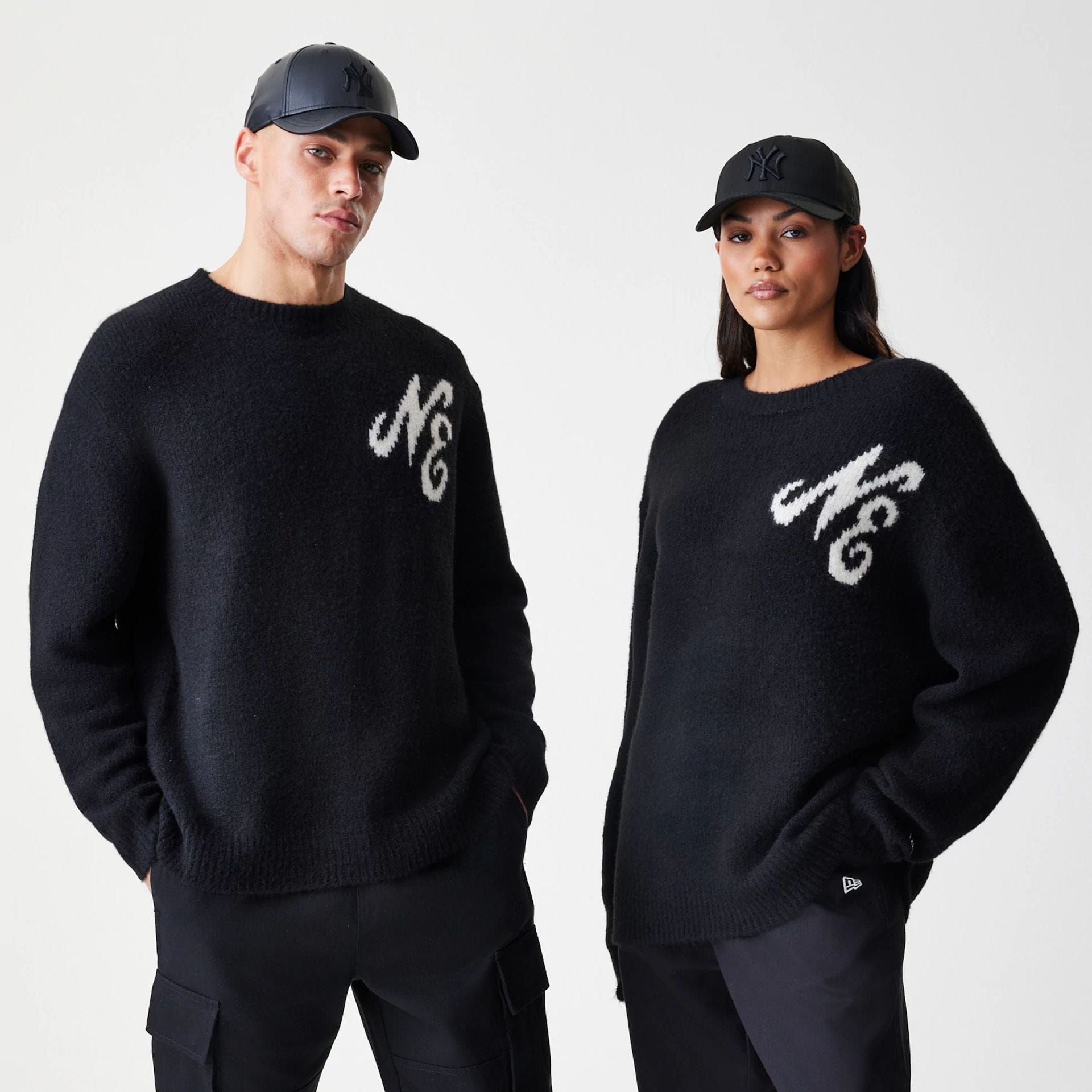 The Male model is wearing New Era Knit Black Knitted Sweater 1