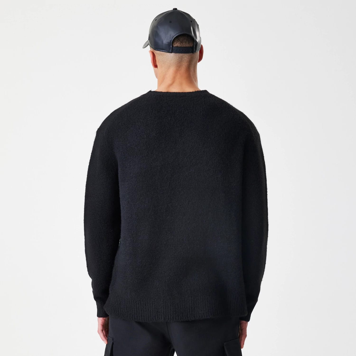 The Male model is wearing New Era Knit Black Knitted Sweater 2
