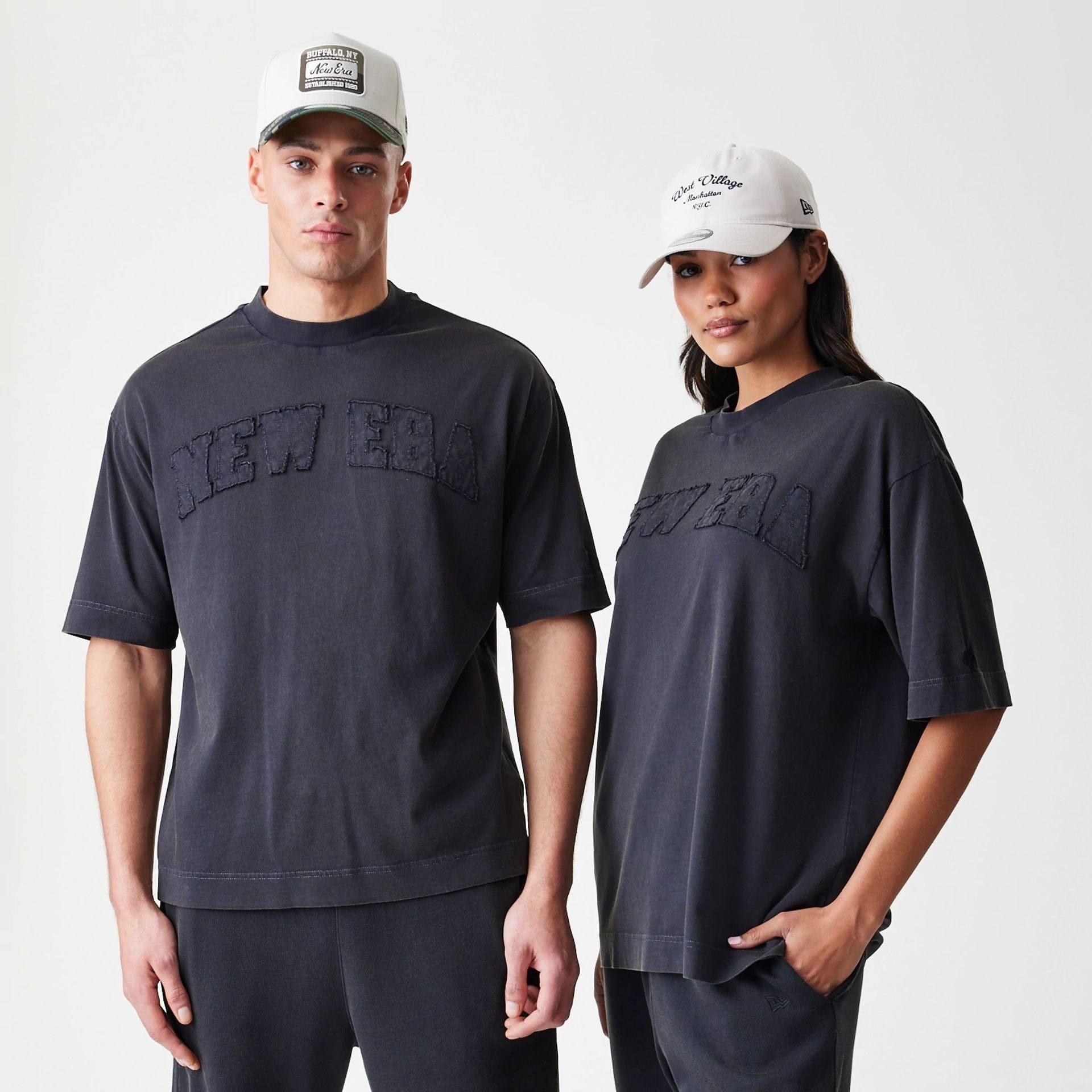 The Male model is wearing New Era Washed Black Oversized T-Shirt 1