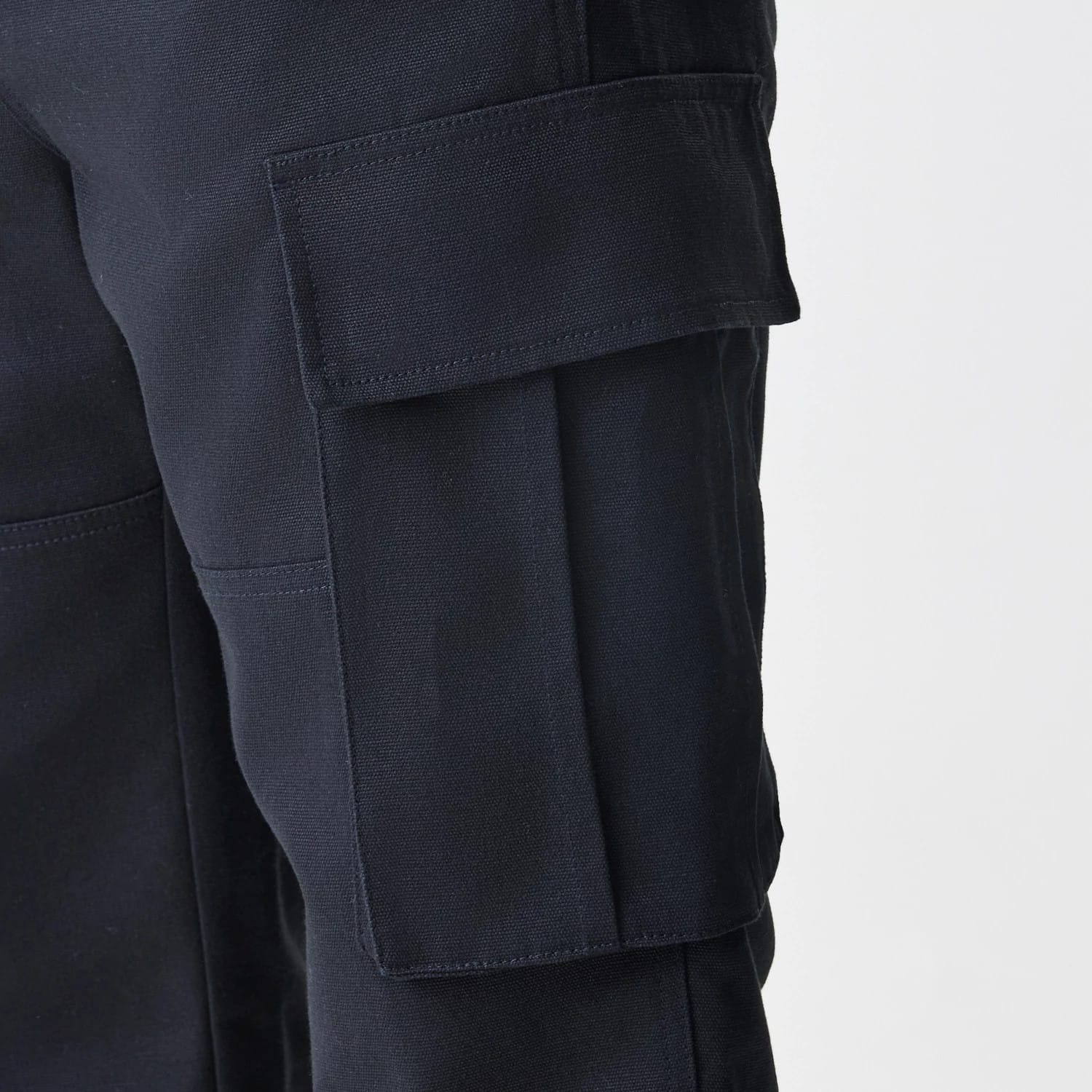 The Male model is wearing New Era Cargo Black Straight Leg Trousers 4