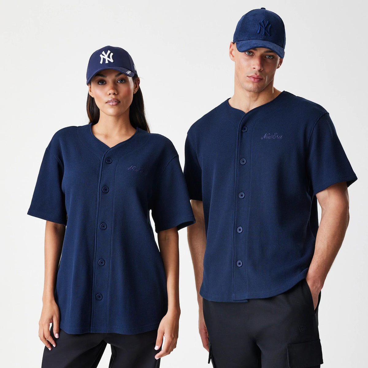 New Era Waffle Navy Jersey, front view on a model showing the navy button-up design with embroidered New Era text on the left chest, paired with a matching navy cap featuring an embroidered NY logo.