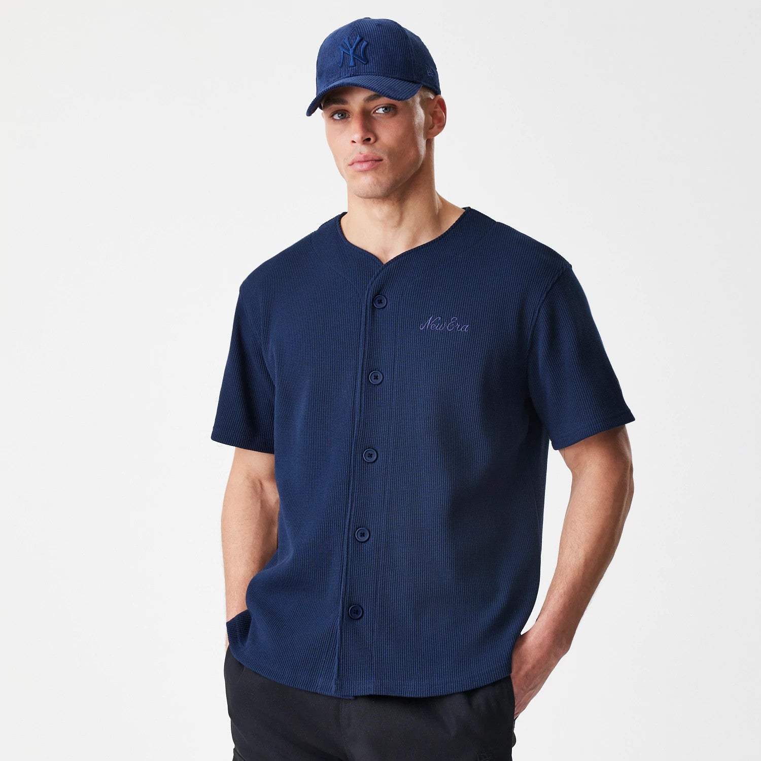 The Male model is wearing New Era Waffle Navy Jersey 3