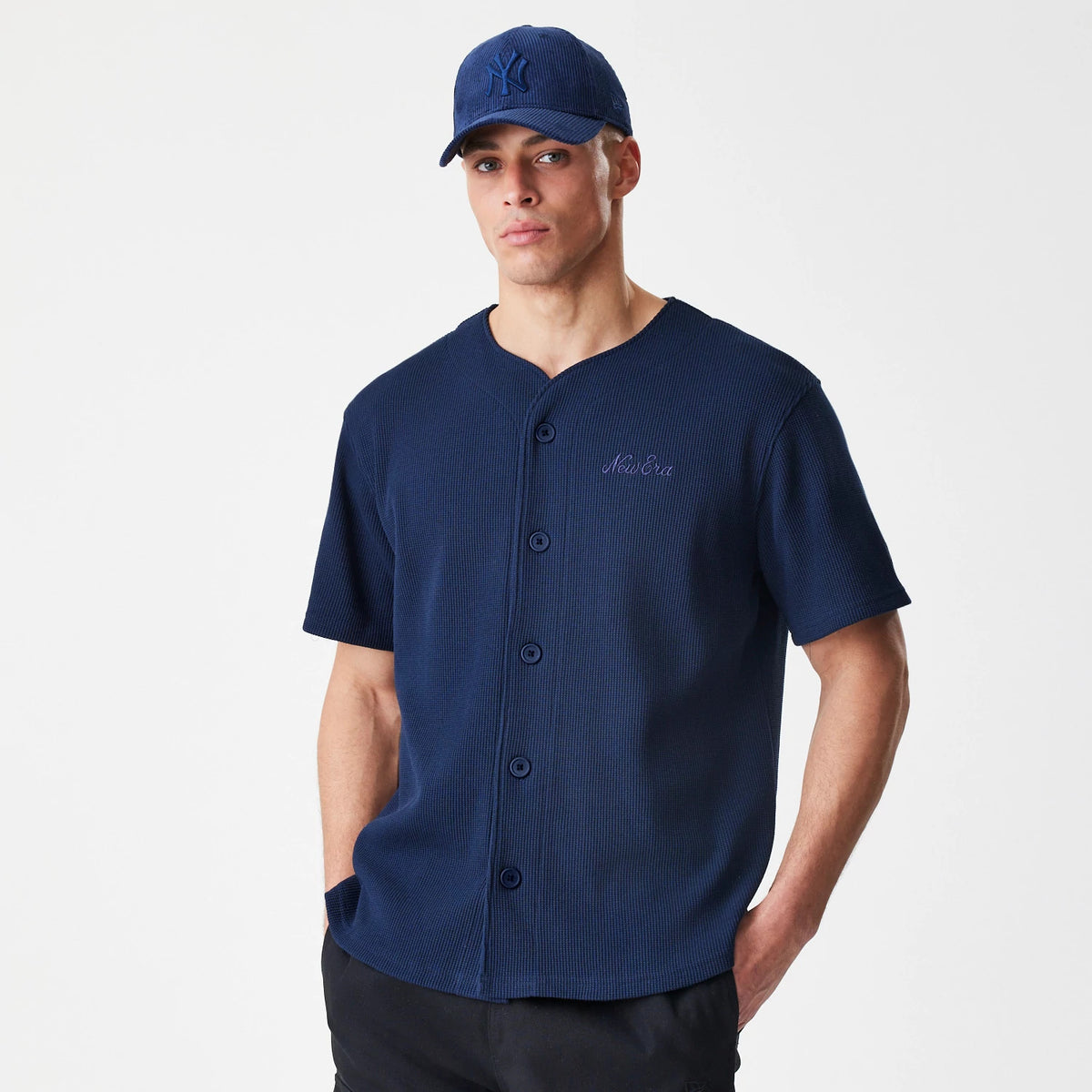 The Male model is wearing New Era Waffle Navy Jersey 3