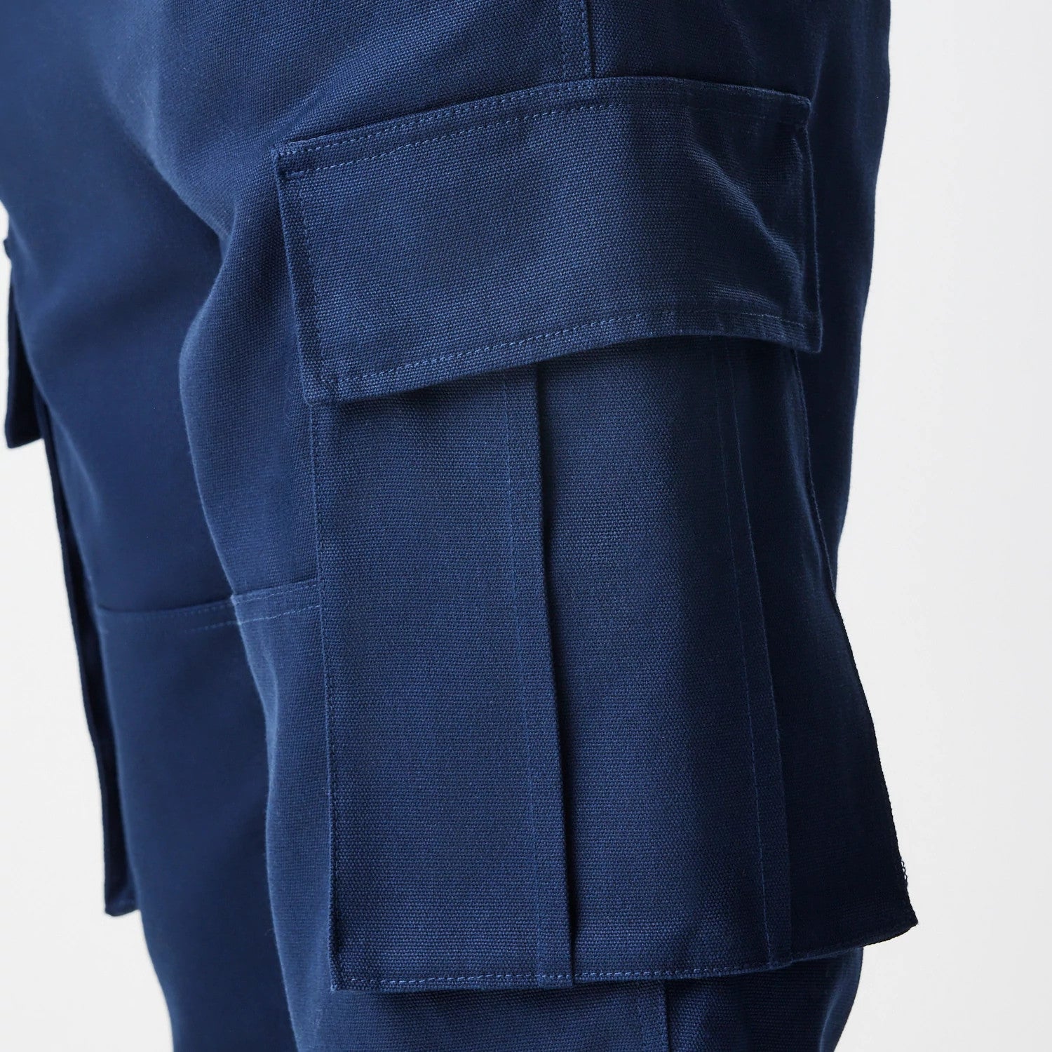 The Male model is wearing New Era Navy Straight Leg Cargo Trousers 4