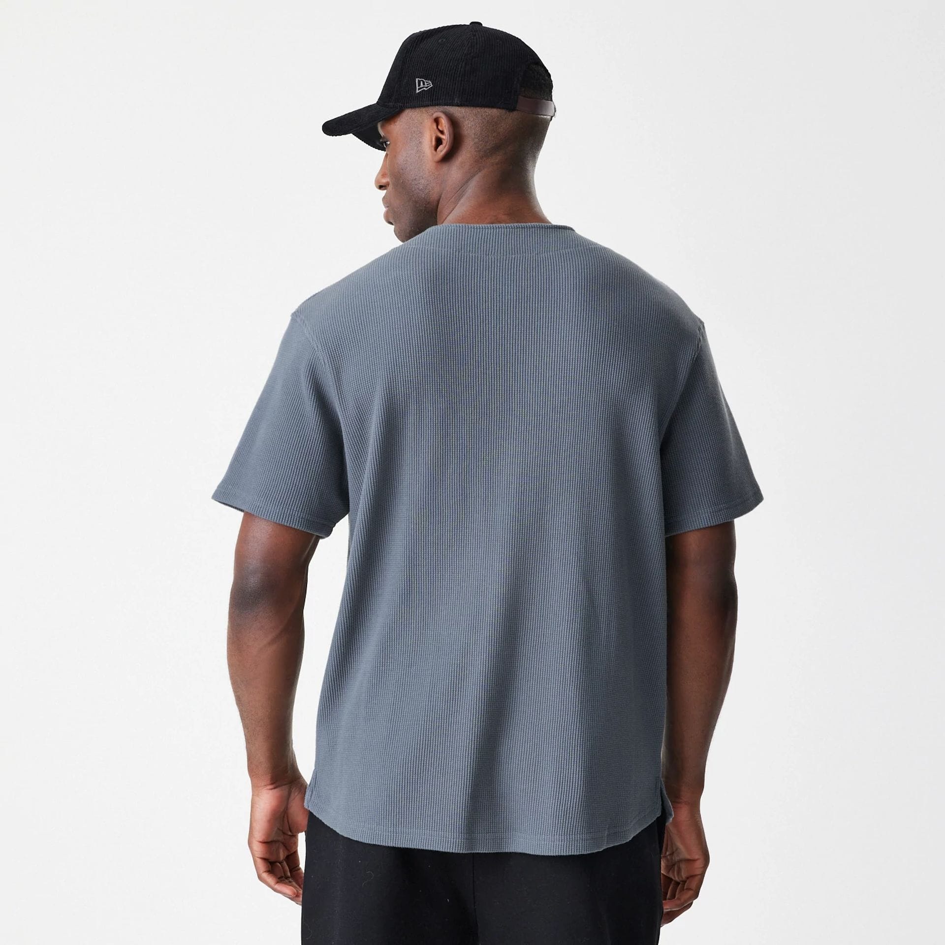 The Male model is wearing New Era Waffle Dark Grey Jersey 2