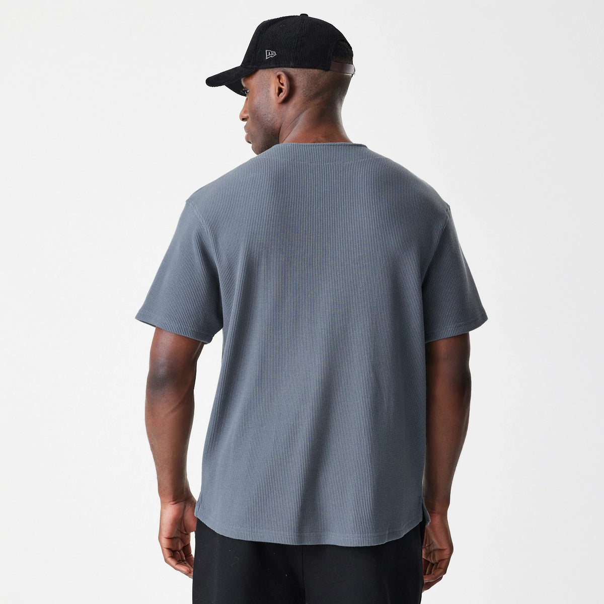The Male model is wearing New Era Waffle Dark Grey Jersey 2