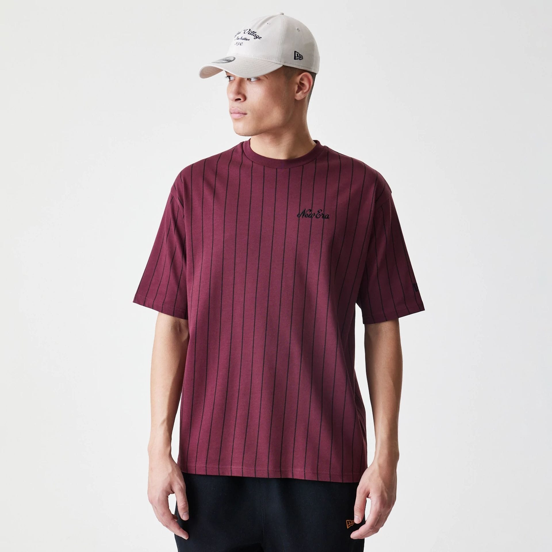 The Male model is wearing New Era Pinstripe Dark Red Oversized T-Shirt 1